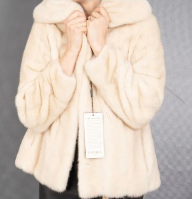 White mink jacket with tags